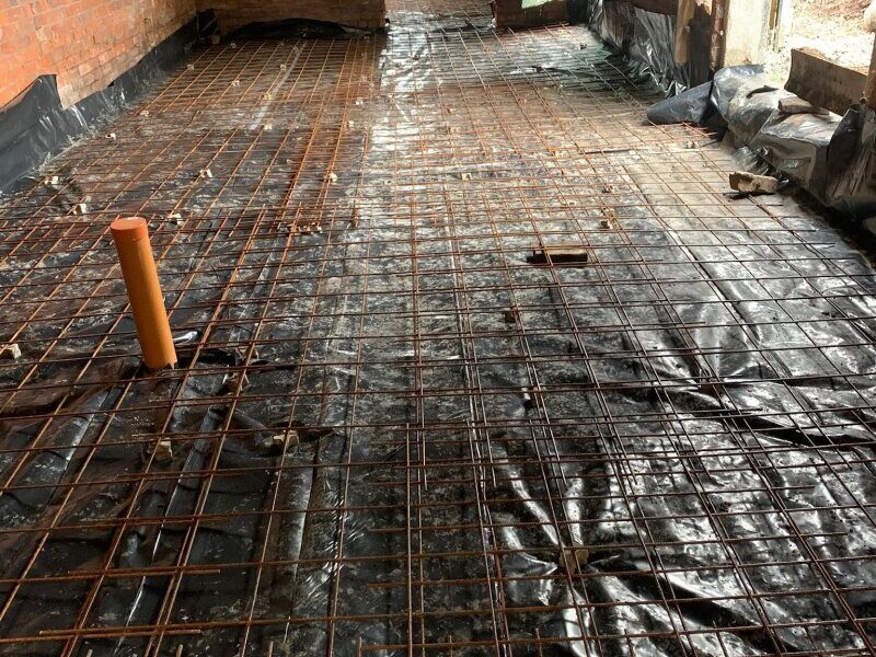 plastic sheeting and steel reinforcement mesh installation
