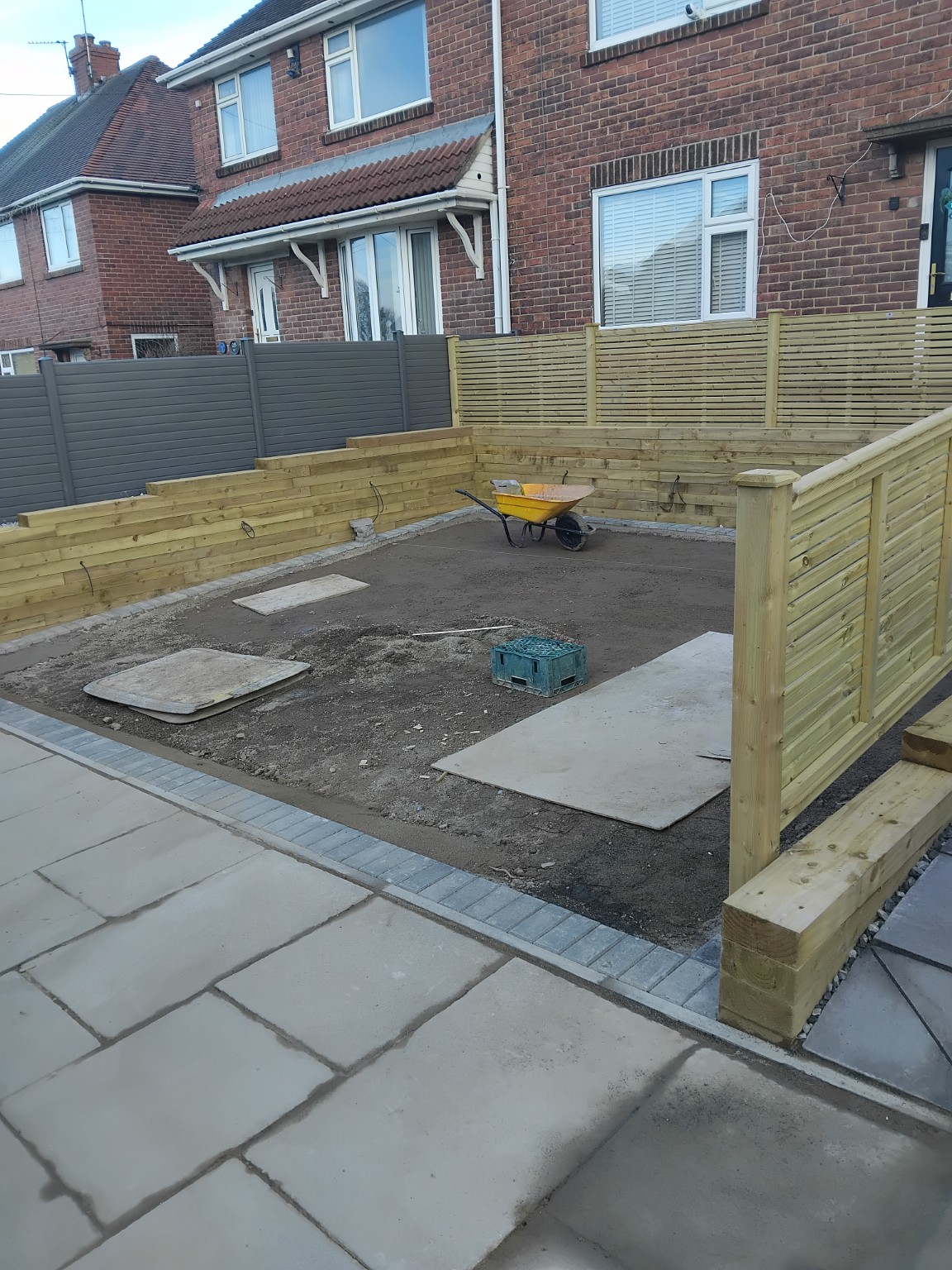 Prepared driveway base within timber sleeper retaining walls