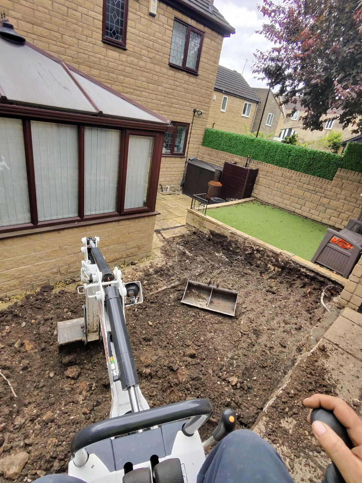 View from a mini excavator across the extension excavation area