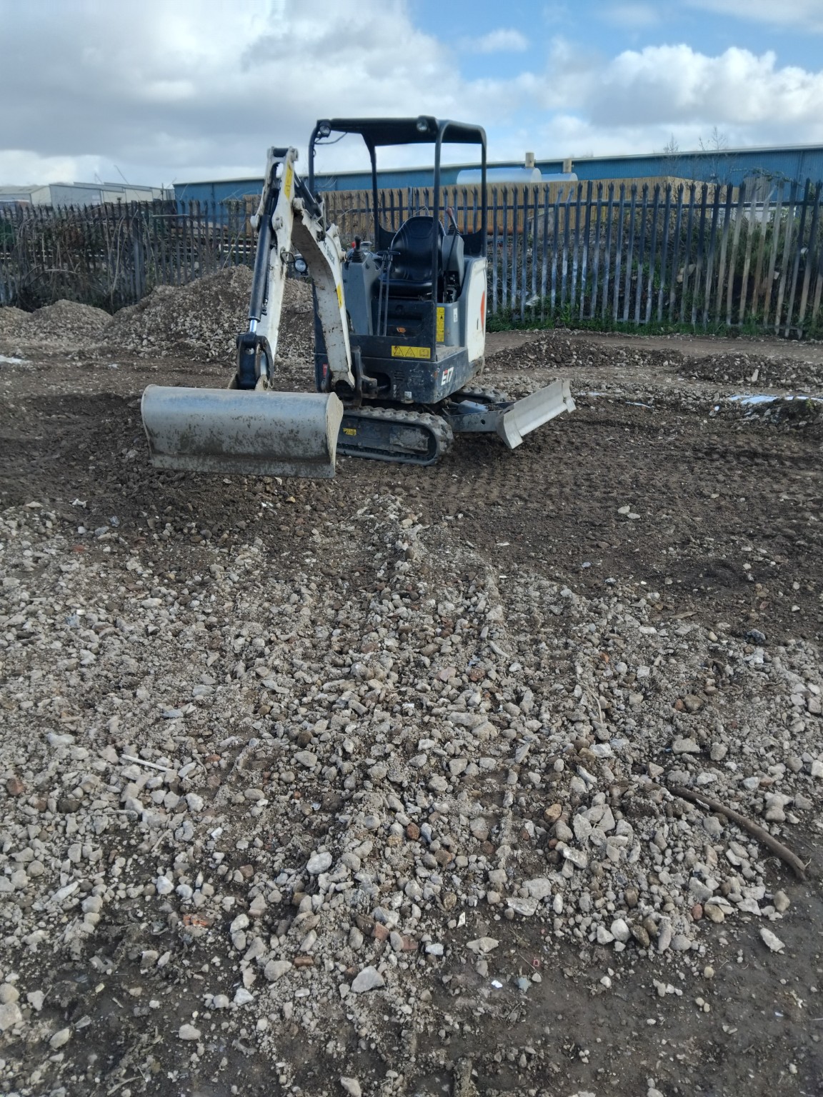 Mini excavator on site during ground preparation for Easy Storage