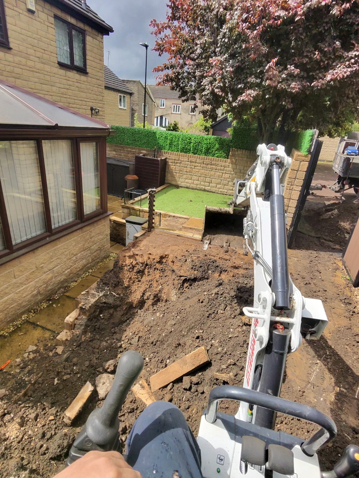 Excavation and ground reduction beside an existing conservatory