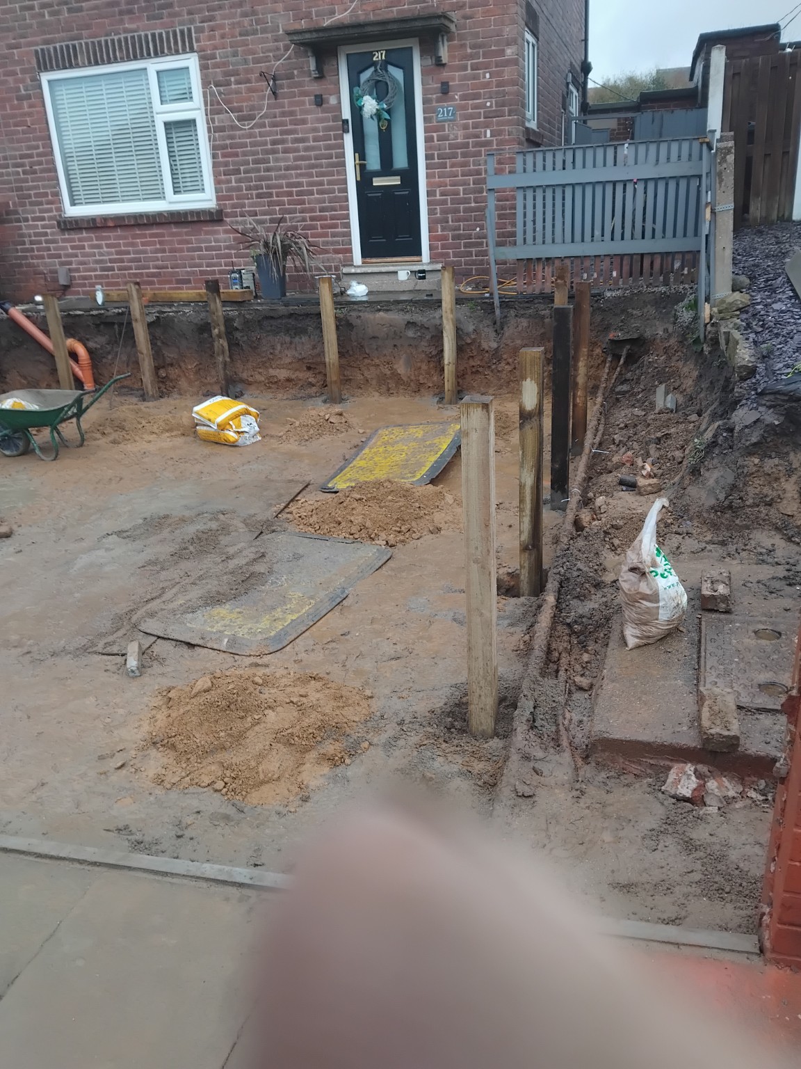 Timber posts set around the lowered driveway area