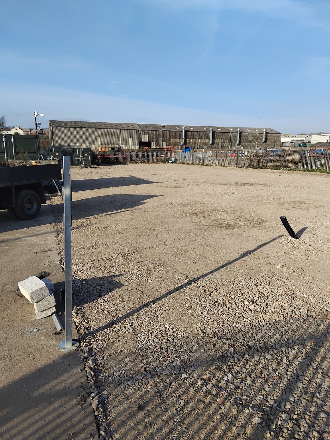 Wide view of the prepared container storage yard after groundworks
