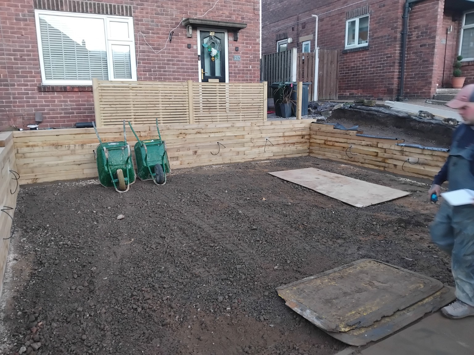 Timber sleeper retaining walls and aggregate driveway base during construction