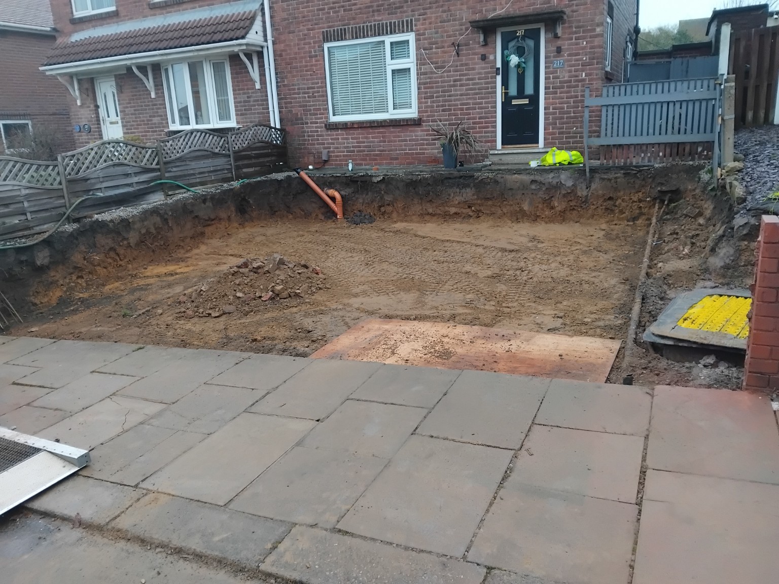 Cleared and levelled ground beside an existing paved area