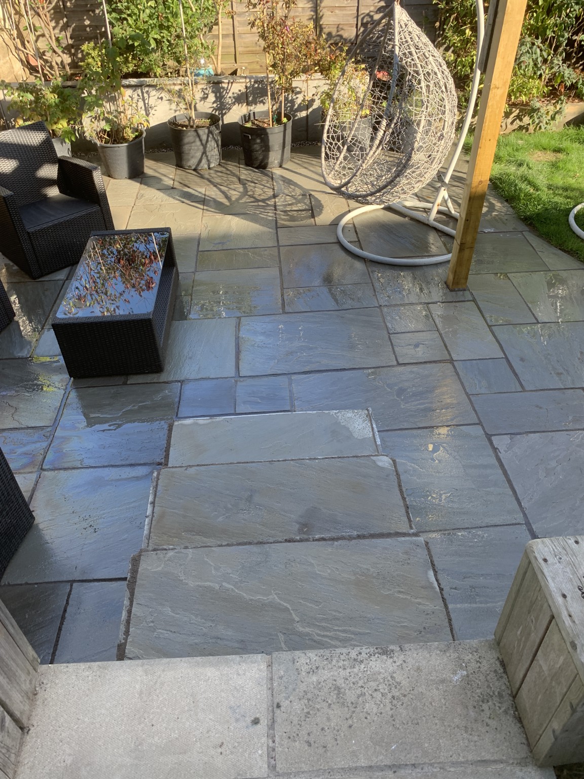 Finished garden patio with seating and steps